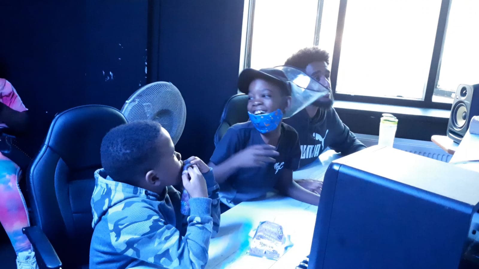 Young people in a Rap Club studio session